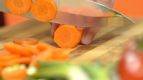 Cutting carrots for salad