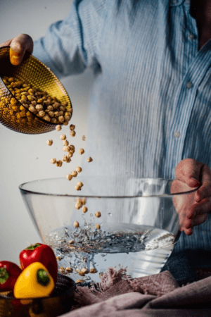 A man soaking chickpeas to make Moroccan Harira