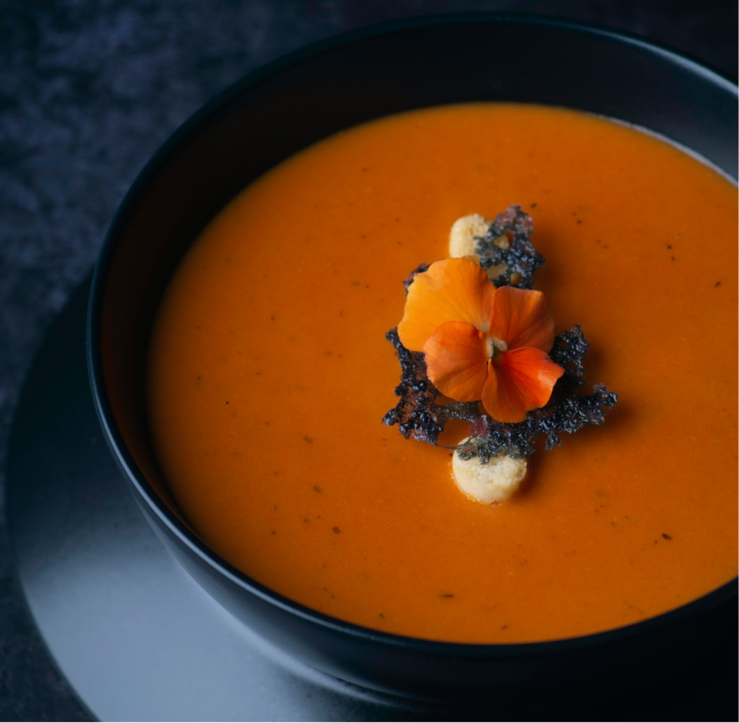 A bowl of tomato soup inspired by gluten-free dishes 
